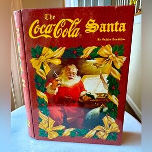 Vintage THE COCA COLA SANTA by HADDON SUNDBLOM Book Shaped Tin Hinged